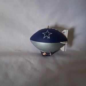 Blue and Gray Dallas Cowboys Blimp With Santa Driving